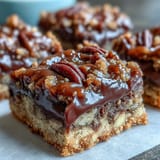 Homemade Decadent Sweet and Chewy Turtle Bars with Chocolate and Caramel showing caramel swirls and toasted pecans.