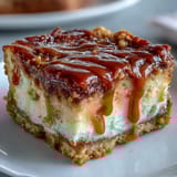 A sliced loaf of Caramel Cream Cheese Bread revealing a creamy cheesecake-like center and sweet caramel ribbon inside.