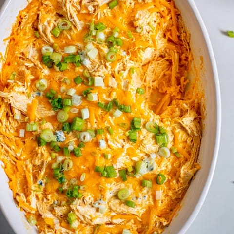 Close up of creamy, flavorful Buffalo Chicken Dip, loaded with melted cheese and shredded chicken.