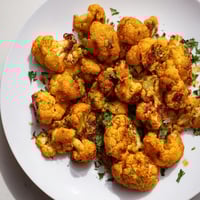 Golden-brown roasted cauliflower, seasoned with spices, perfect as a flavorful and healthy side.
